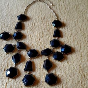 Black and gold tone necklace